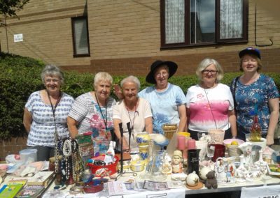 Ladies on a stall at a garden party at Carrs Lane Gardens